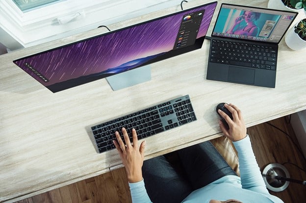 person using laptop on table